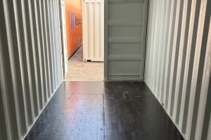modified shipping container with door and window